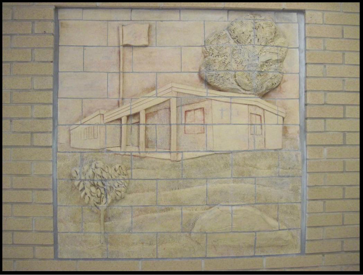 Carving of school building in the brick work of the school